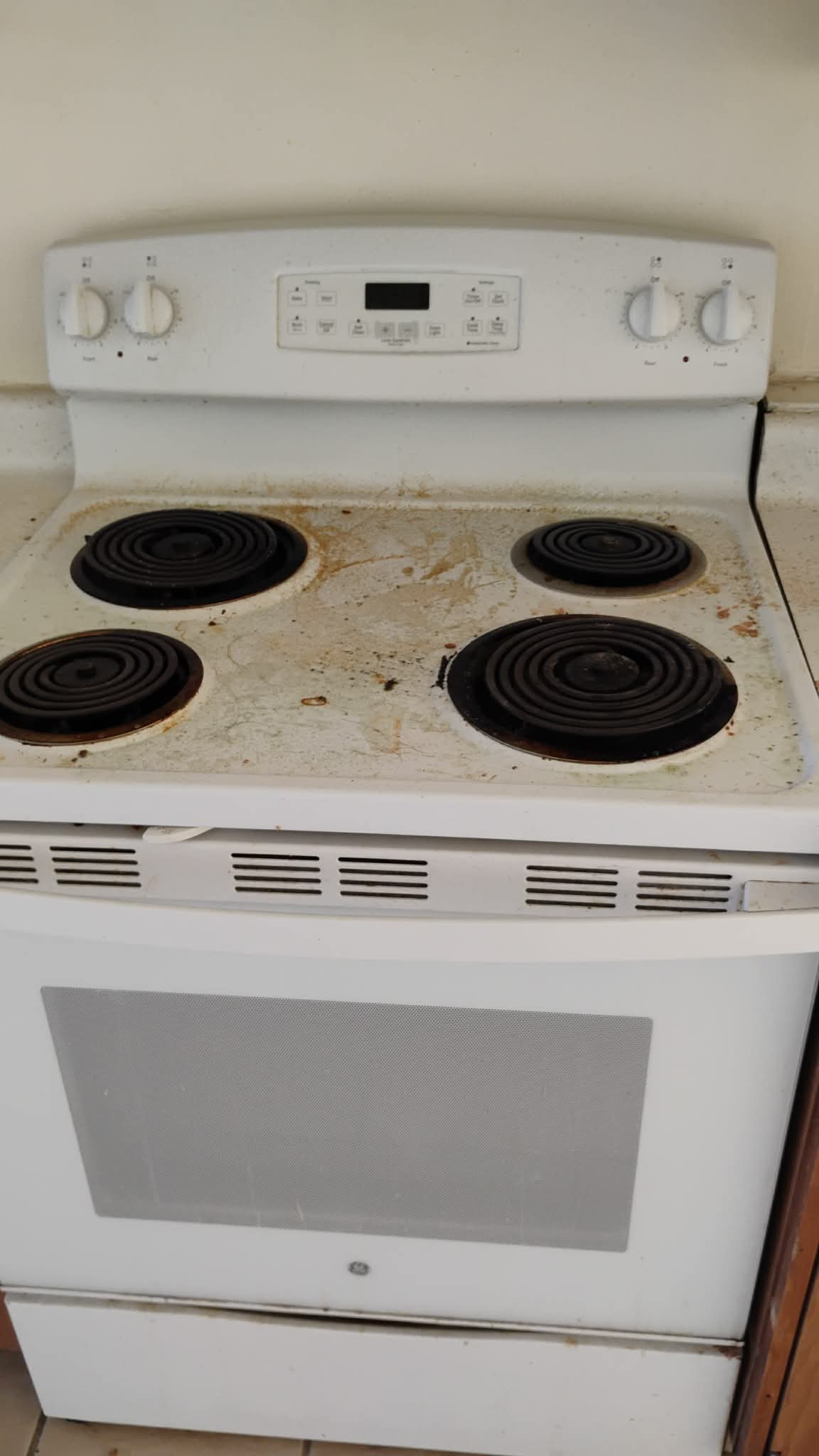 Kitchen stove before deep cleaning by A&A Cleaning Services in San Antonio